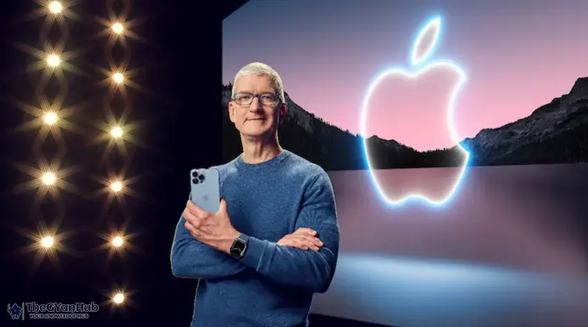 Apple CEO Tim Cook speaking at an event with Apple logo in the background